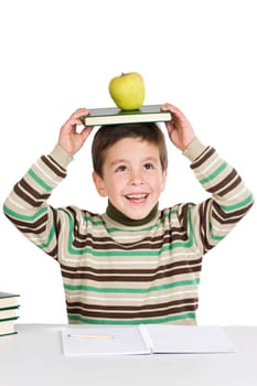 Adorable child studying with books