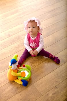Baby and toy clown