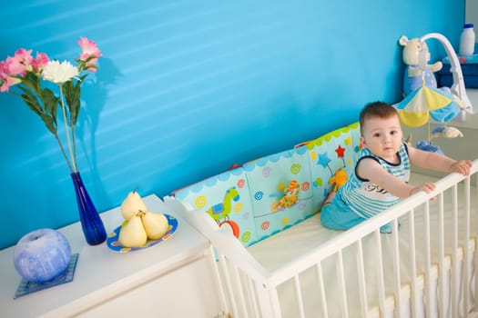 Baby on crib at home
