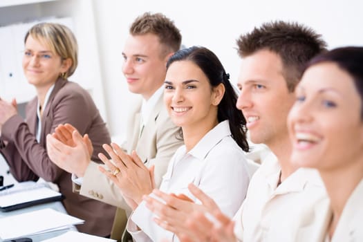 Clapping business people