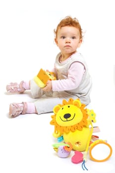 Redhead baby playing