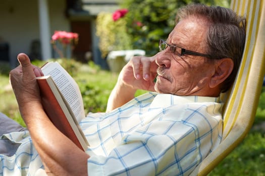 Senior man reading outdoor