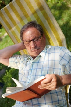 Senior man reading outdoor