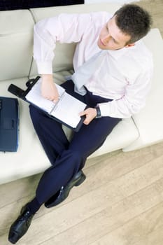 Businessman sitting on couch