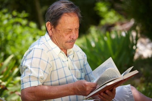 Old man reading book