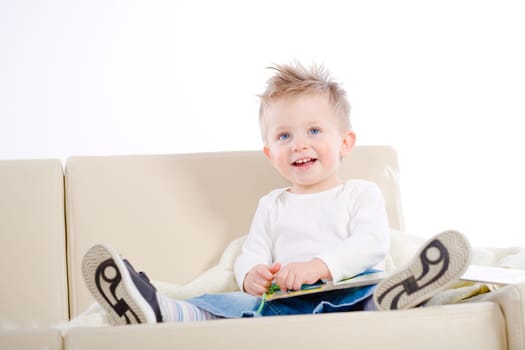 Baby boy reading book