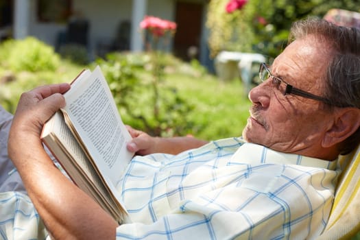 Senior man reading outdoor
