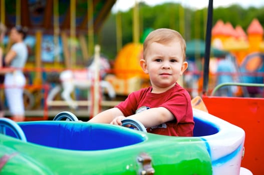Child driving toy vehicle