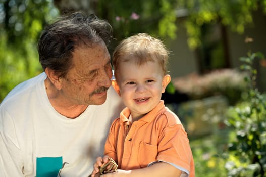 Grandfather and grandson play