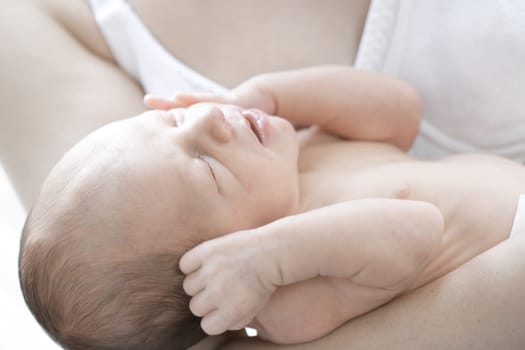 Newborn baby in mothers hand
