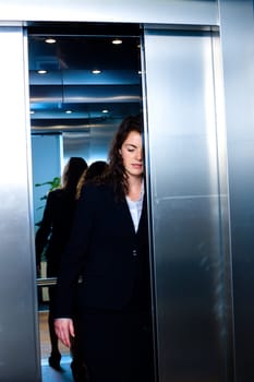 Businesspeople in elevator