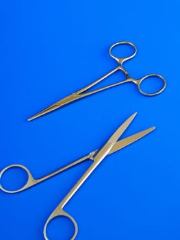 surgical tools over blue background