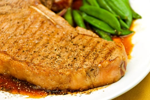 T-bone steak with potatoes,large beans