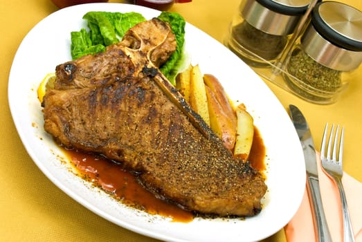 T-bone steak with red potatoes