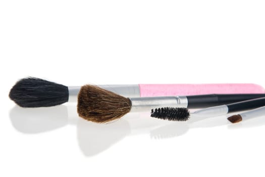 Makeup brushes on white background