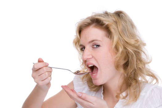Young woman eating cereal