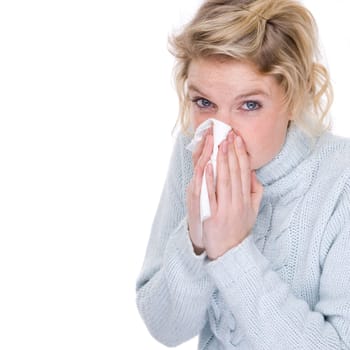 Woman blowing her nose