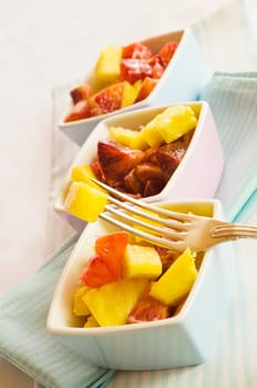 three bowls of fruit salad