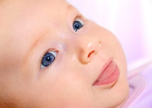 Little girl looks kindly at her mother