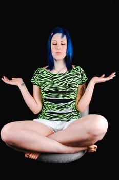 Blue hair girl meditating.