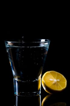Water glass with lemon