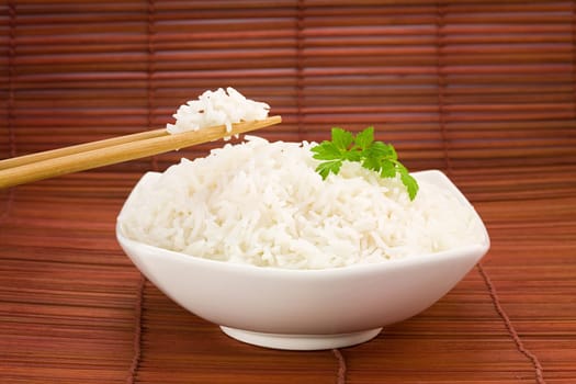 Bowl of rice on mat