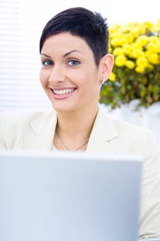 Businesswoman working on laptop