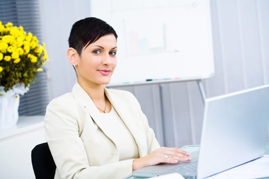 Businesswoman working on laptop