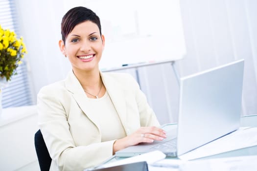 Businesswoman working on laptop