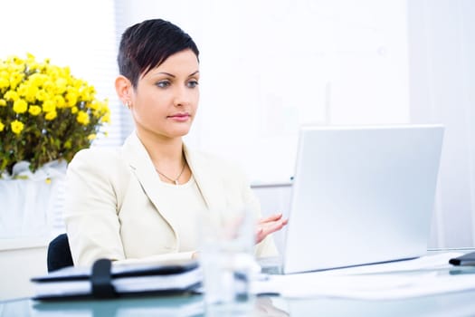Businesswoman working on laptop