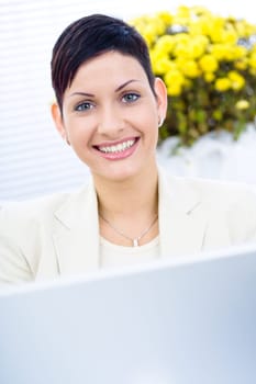 Businesswoman working on laptop