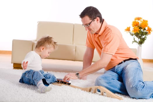 Father and baby boy playing