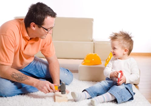 Father and kid playing