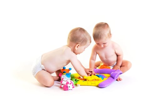 Baby twins playing