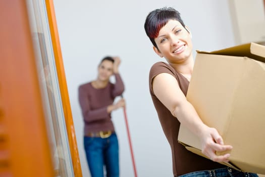 Young woman with cardboard box