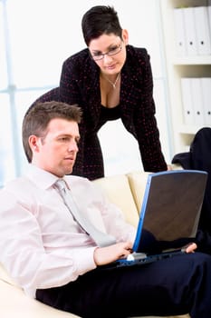 Businesspeople teamworking on laptop