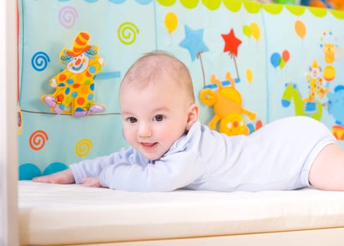 Smiling baby in bed