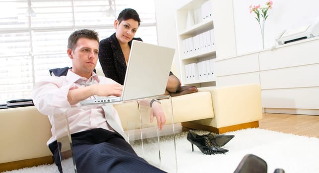 Businesspeople working on computer