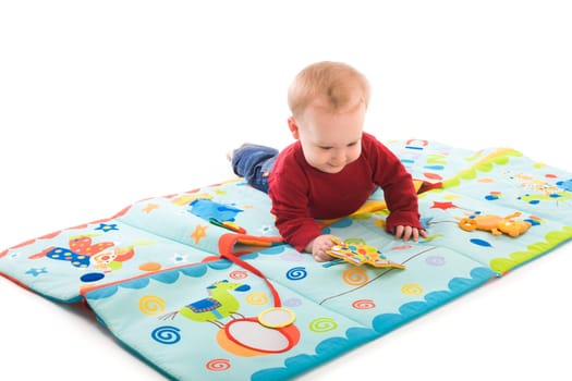 Baby boy playing with toys