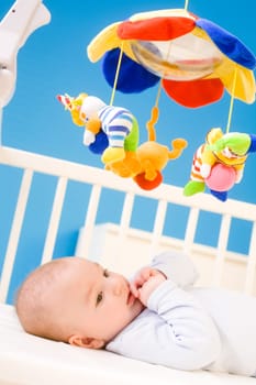 Baby playing in bed