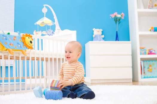 Happy baby playing indoor
