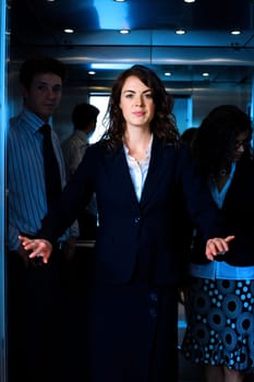 Businesspeople in elevator