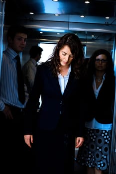 Businesspeople in elevator