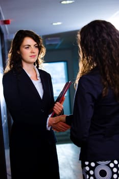 Businesswomen shaking hands