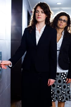 Young businesswomen at office corridor