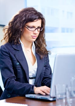 Businesswoman using laptop
