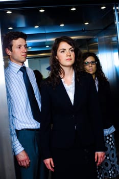 Businesspeople in elevator