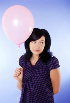 Young woman with balloon