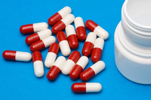 Pills over blue background