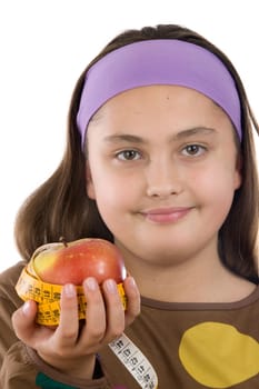 Cute girl with a apple with tape measure